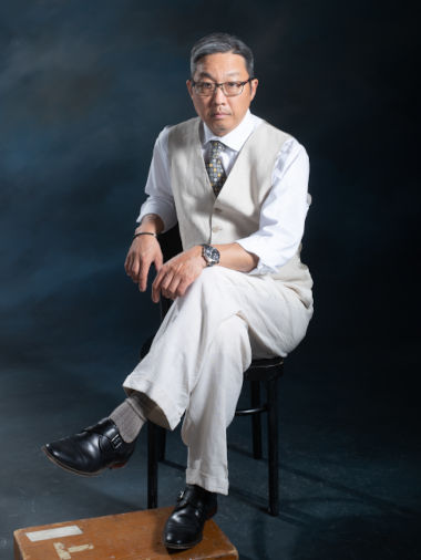 Photo of Jason W. Park, seated, in a white suit, 380x506 pixels