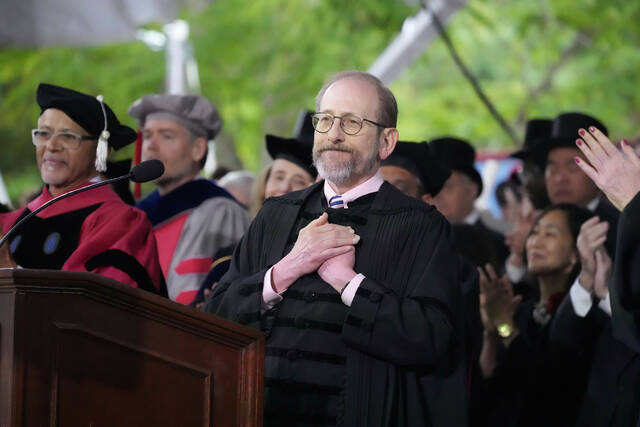 Harvard President Alan Garber acknowledges an extended round of applause during Harvard University’s commencement ceremonies May 29 in Cambridge, Mass. Harvard President Alan Garber acknowledges an extended round of applause during Harvard University’s commencement ceremonies, Thursday, May 29, 2025 in Cambridge, Mass. (AP Photo/Charles Krupa)